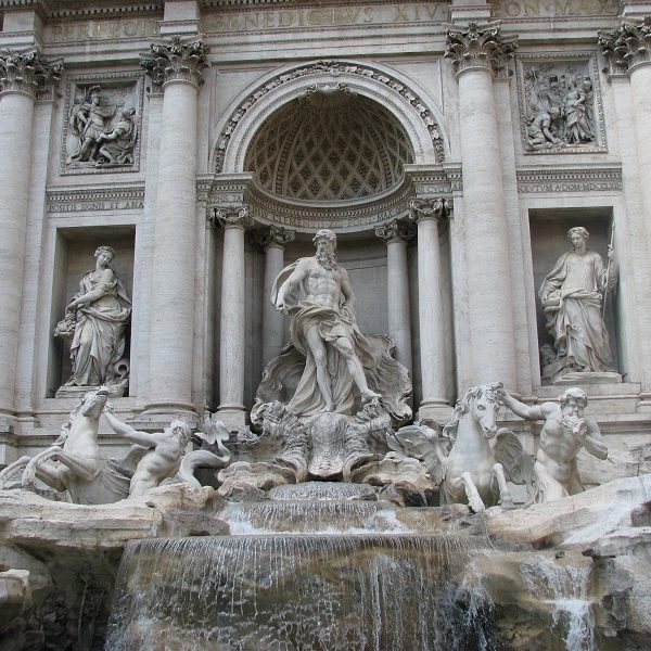 A large stone statue in front of Trevi Fountain - Trevi Fountain